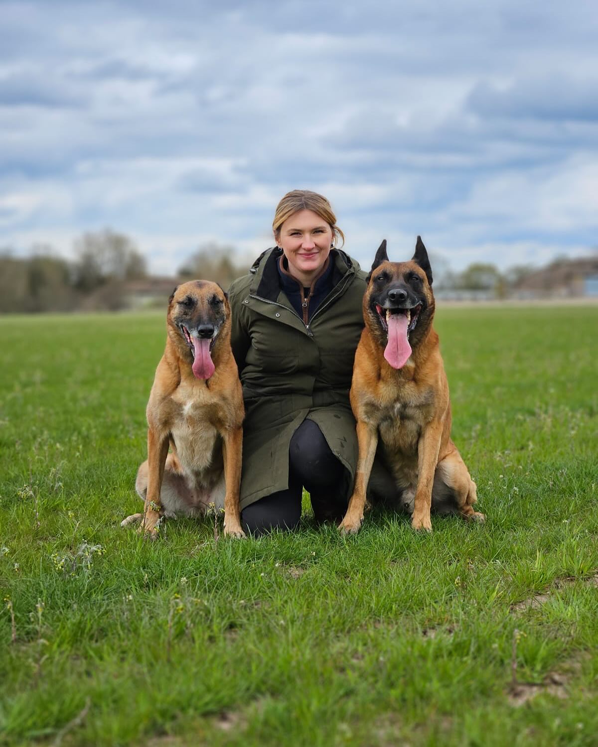 Lydia with 2 dogs in a large field in Birmingham