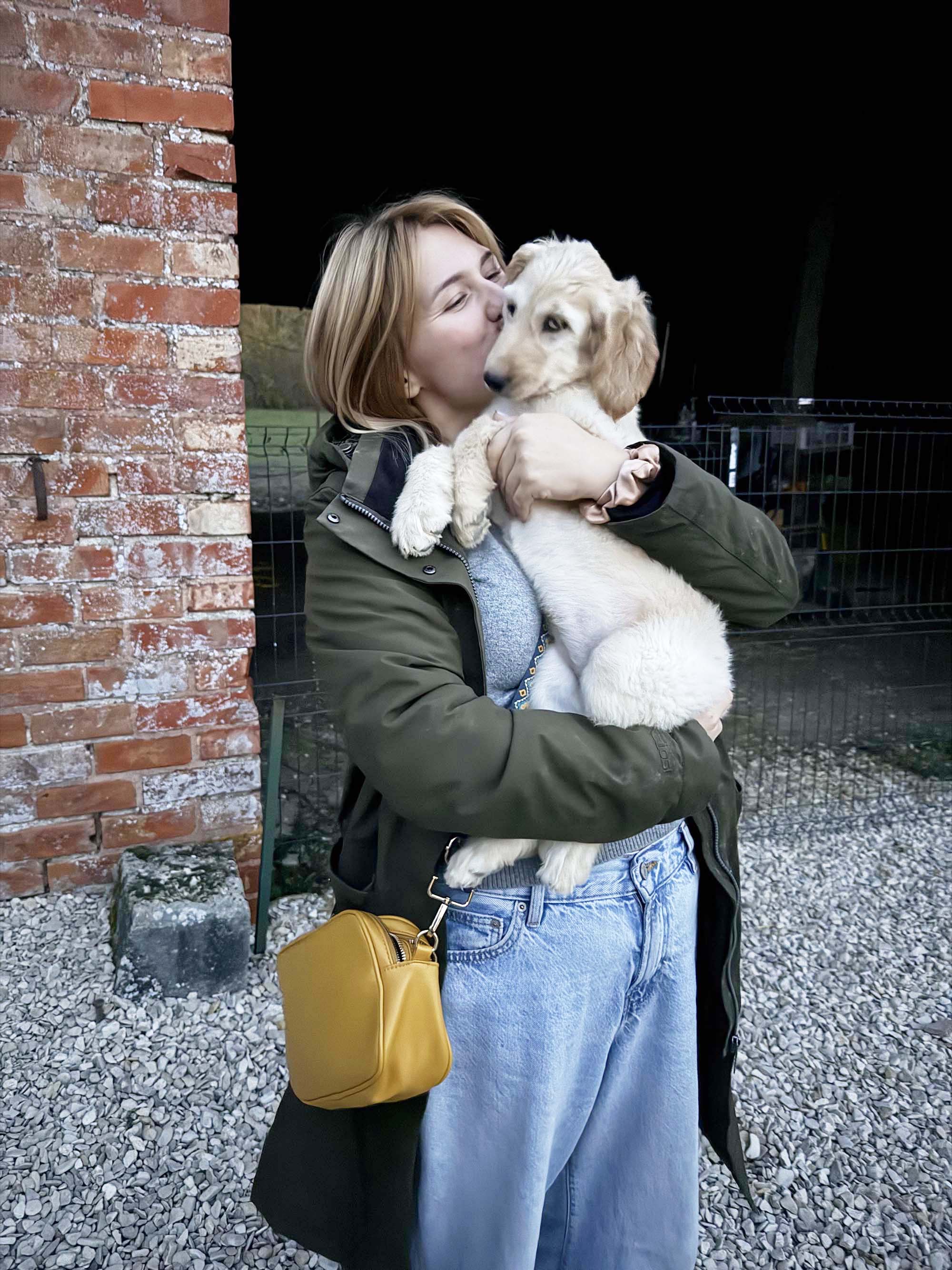 Lydia Harrison holding a puppy in Birmingham